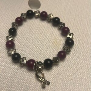 Handcrafted burgundy and black glass bead stretch bracelet with hope ribbon
